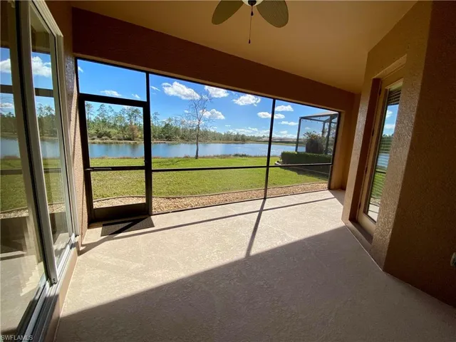 Unfurnished sunroom featuring a water view and plenty of natural light