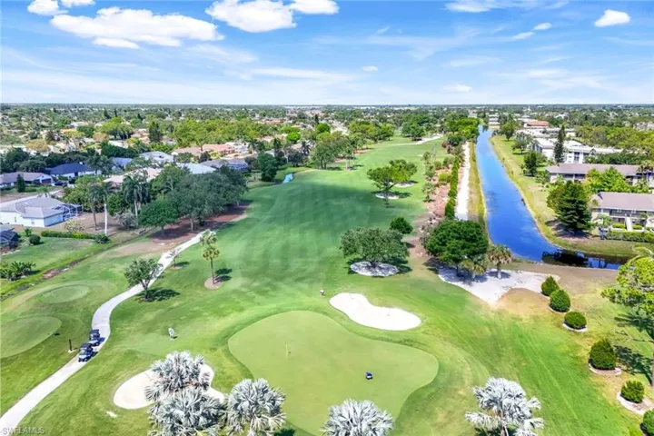 Bird's eye view of a large body of water and a local golf course