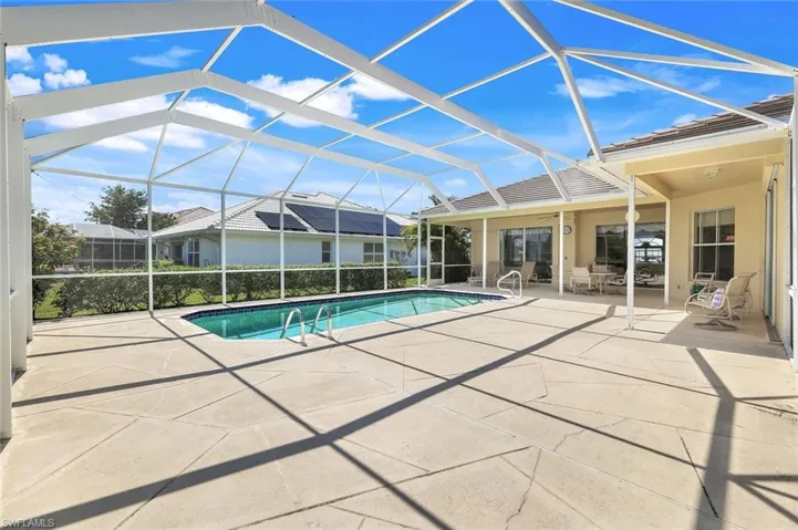 Outdoor pool featuring a patio area and a lanai