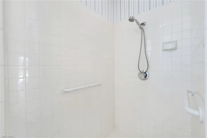 Full bathroom featuring a tile shower