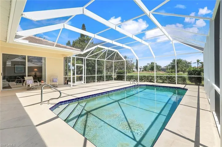 Swimming pool with a patio area and a lanai