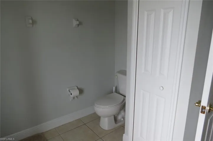 Bathroom featuring toilet and tile patterned floors