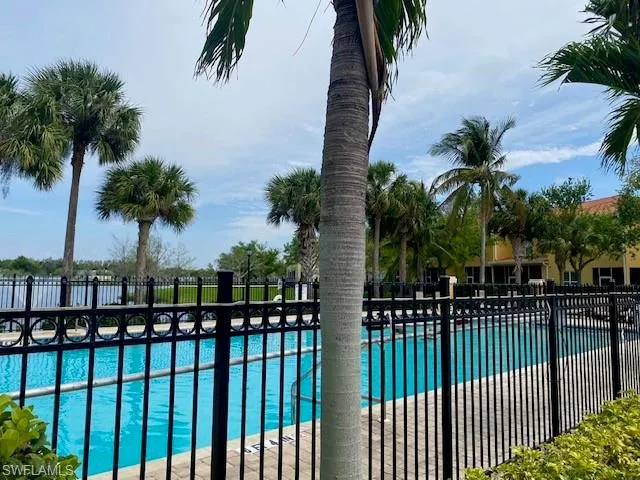 Community pool featuring a patio