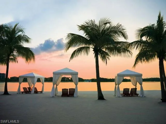 Sunset Beach with cabanas at Miromar Lakes
