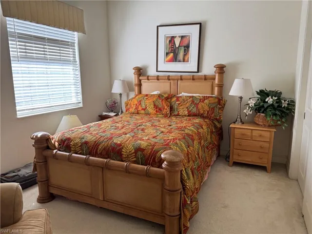 Bedroom with light carpet