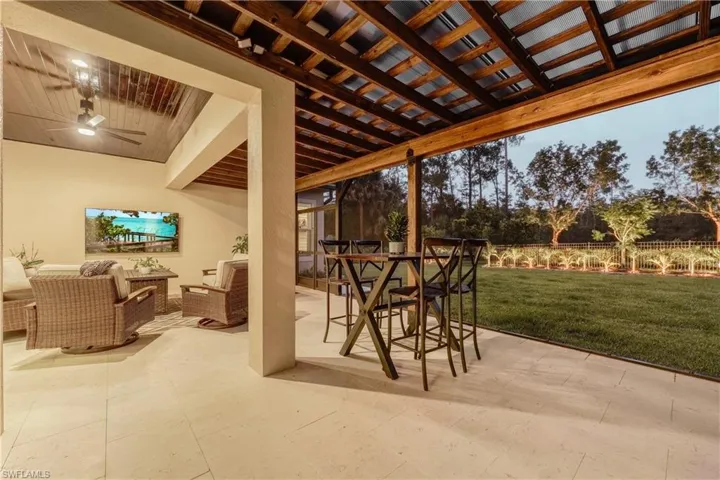 View of patio featuring outdoor dining area, a ceiling fan, and an outdoor living space