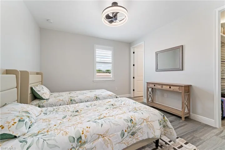 Bedroom featuring light wood-type flooring and baseboards