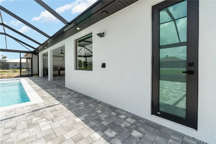 View of pool featuring a patio area and a lanai