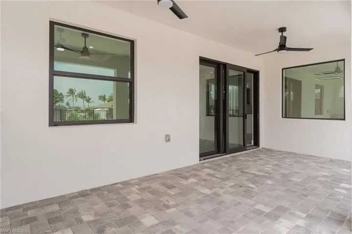 View of patio featuring ceiling fan