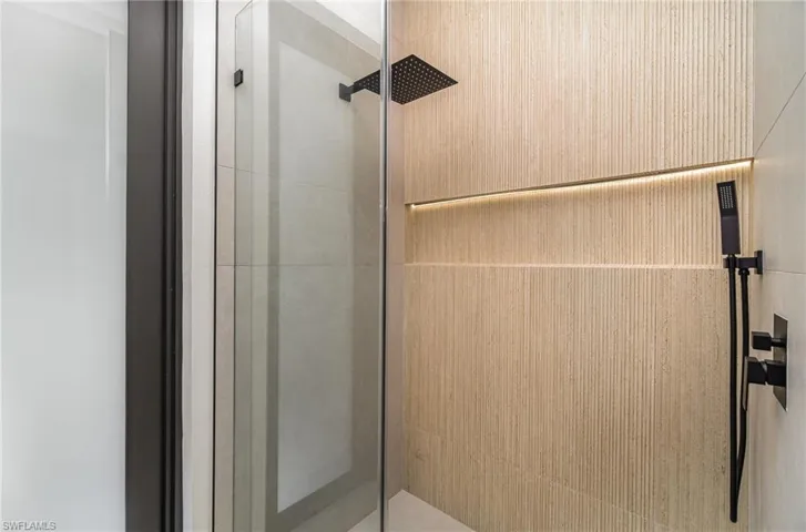 Bathroom with a shower with door