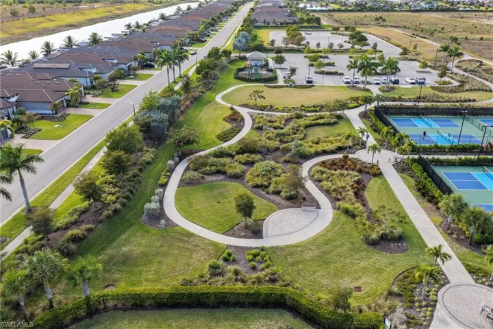 Aerial perspective of suburban area with a nearby body of water