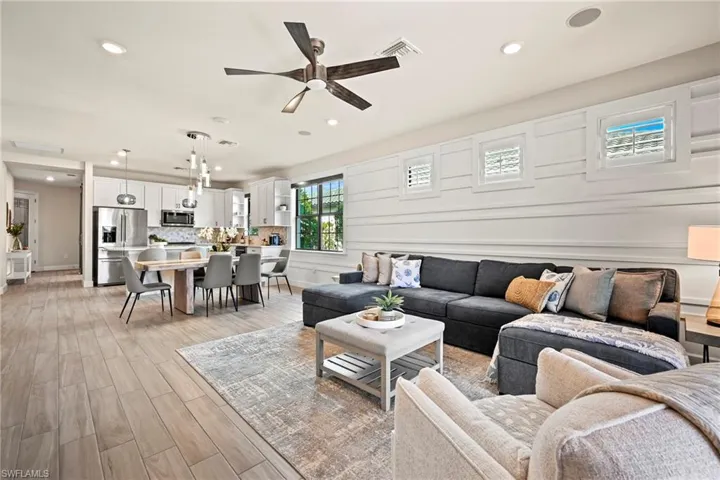 Living area featuring ceiling fan, wood finish floors, and recessed lighting