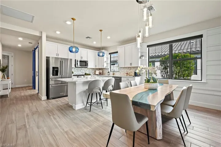 Dining space featuring light wood-style floors and recessed lighting