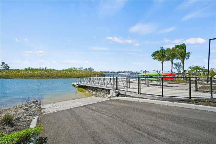 Dock area with a boat ramp and a water view