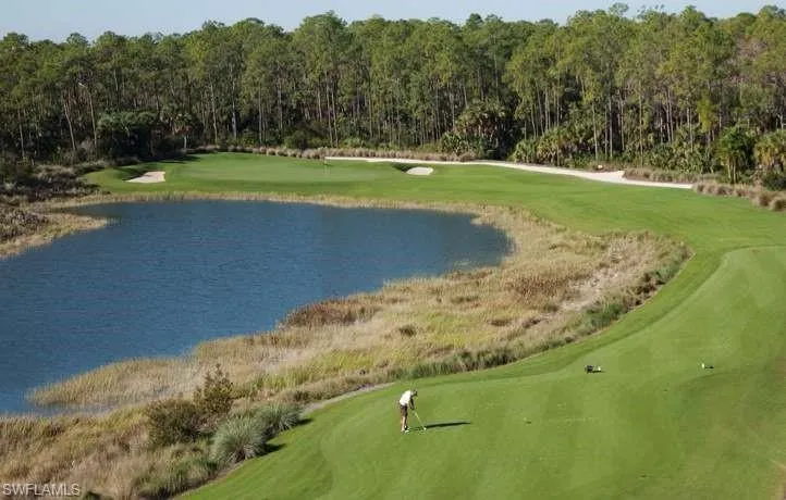 View of property's community with a water view and view of golf course