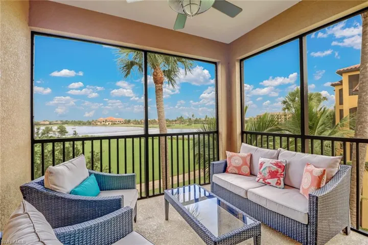 Sunroom with a water view, a ceiling fan, outdoor lounge area, and healthy amount of natural light