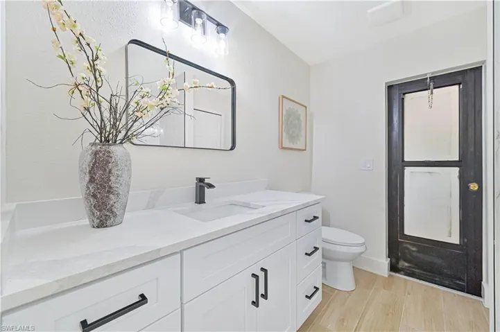 guest bathroom to with access to the lanai