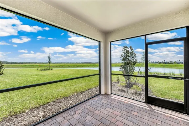 Unfurnished sunroom with a water view