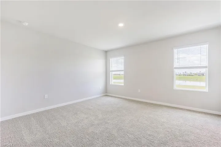 Unfurnished room featuring carpet flooring and recessed lighting