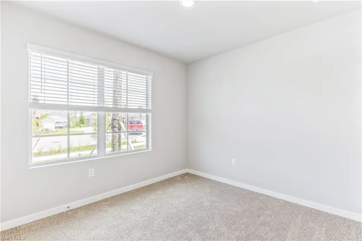 Spare room with carpet flooring and baseboards