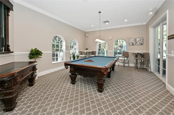Recreation room with pool table, crown molding, recessed lighting, and healthy amount of natural light