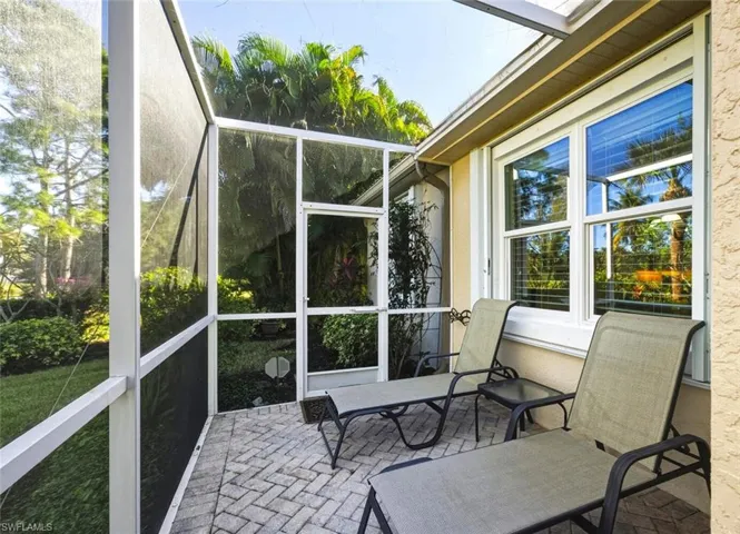 Sunroom with a patio