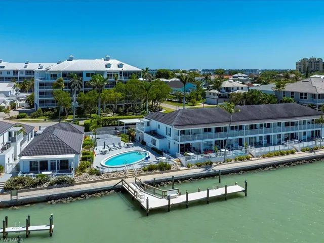 Aerial view with a residential view and a water view