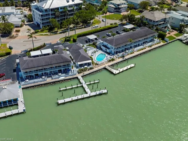 Aerial view featuring a residential view and a water view