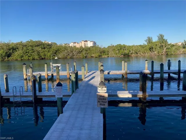 Dock area featuring a water view