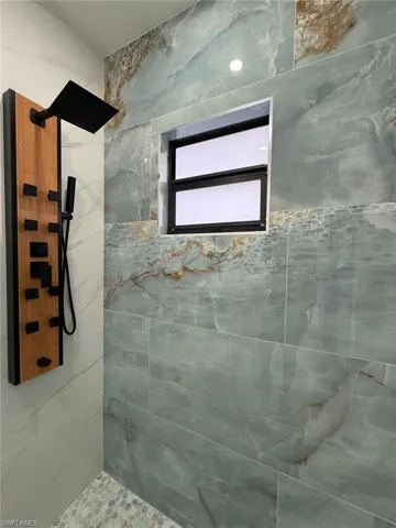 Bathroom with tiled shower