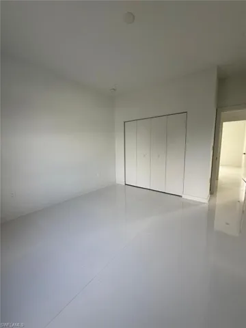 Unfurnished bedroom featuring a closet