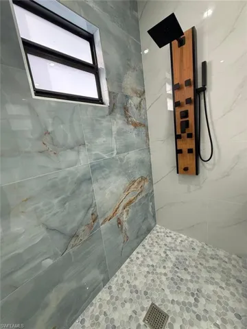 Bathroom with tiled shower