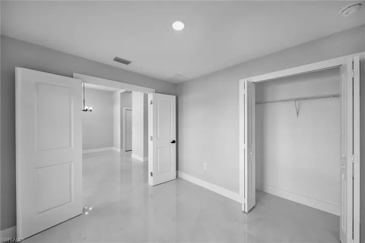 Unfurnished bedroom with a closet