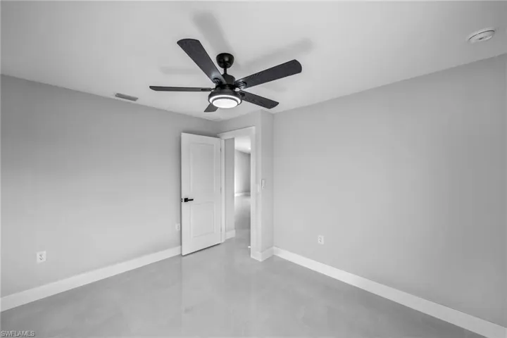 Unfurnished bedroom with ceiling fan