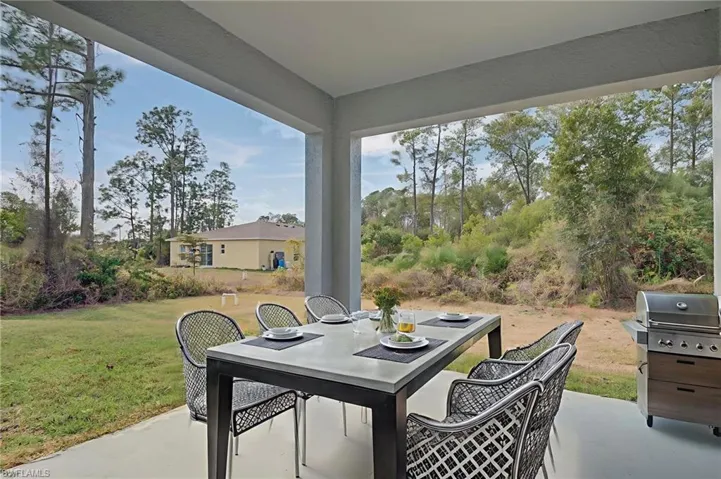 View of patio / terrace with outdoor dining space and a grill