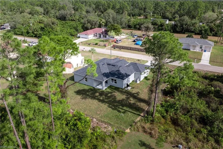 View of subject property featuring a forest