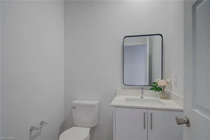 Half bath with vanity and toilet