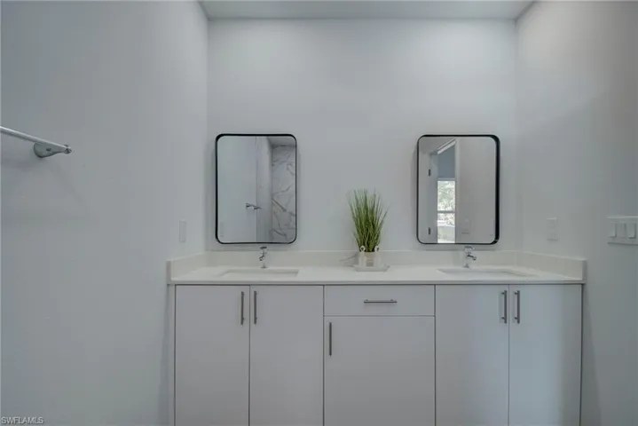 Full bathroom with double vanity