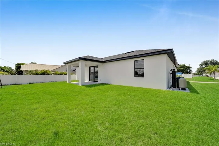 Rear view of property with stucco siding and a patio