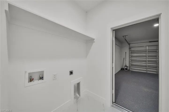 Washroom with hookup for an electric dryer and hookup for a washing machine