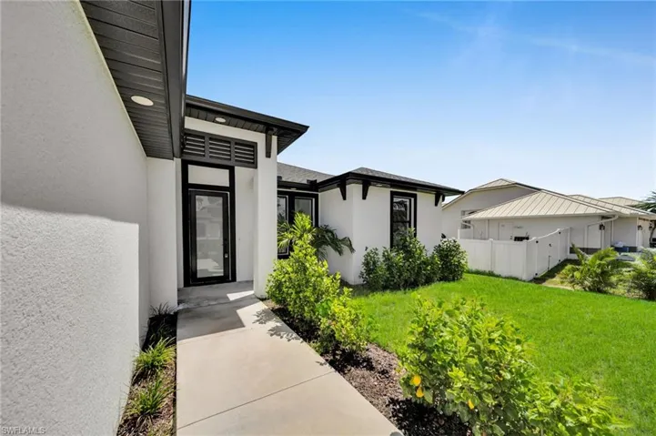 Property entrance with stucco siding