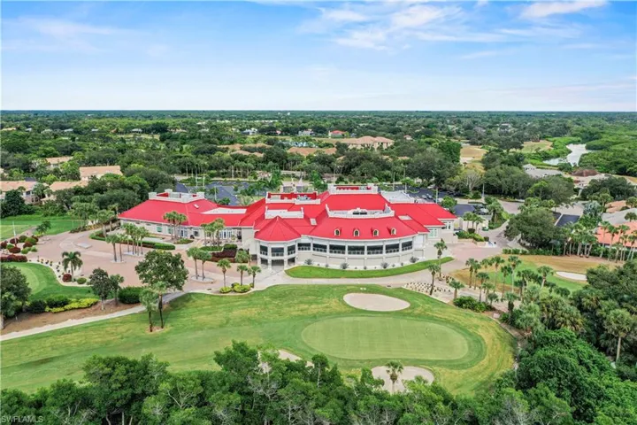 Aerial view of a tree filled landscape and a local golf course