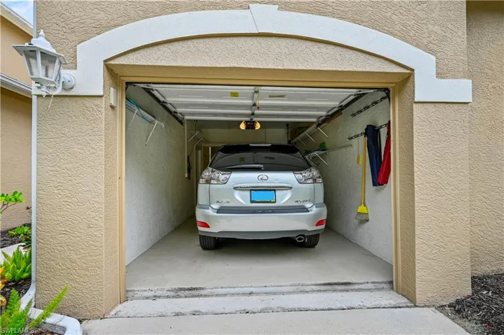 Garage featuring a garage door opener