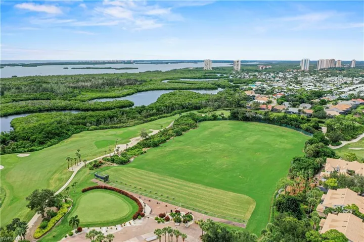 Drone / aerial view of a large body of water and a golf club