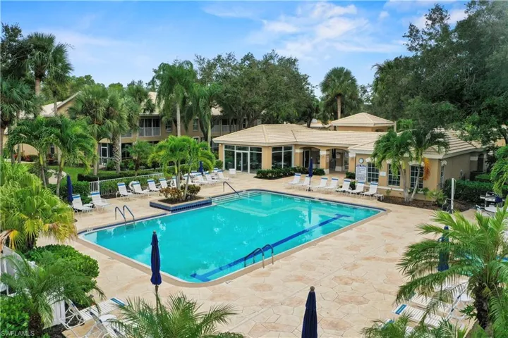 Community pool with a patio
