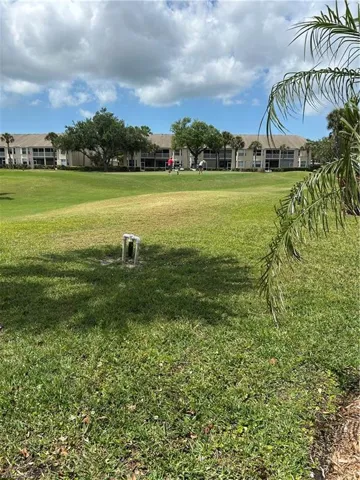 View of community featuring a lawn