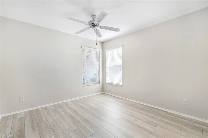 Neutral-toned walls complement wood-finish flooring