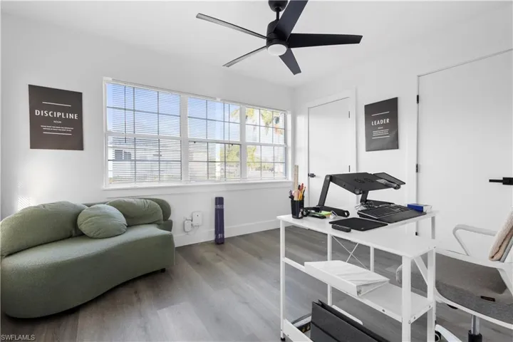 Office space featuring ceiling fan and hardwood / wood-style floors