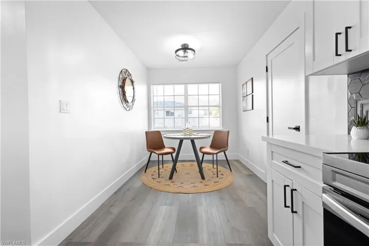 Dining area with hardwood / wood-style floors