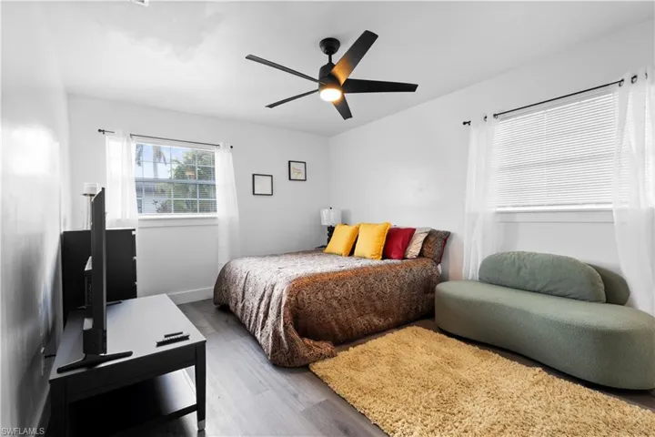 Bedroom featuring hardwood / wood-style floors and ceiling fan
